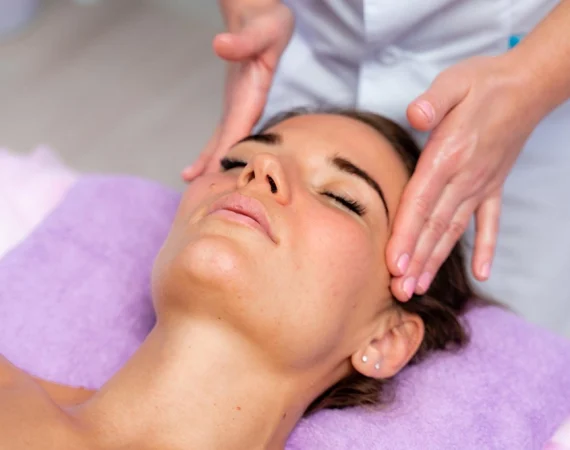 A professional therapist performing a Crystal Clear Microdermabrasion treatment at Beauty by Ruth Maghull to exfoliate and rejuvenate a client's skin.